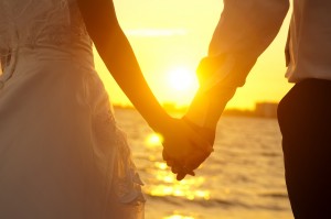 Sunset holding hands photo
