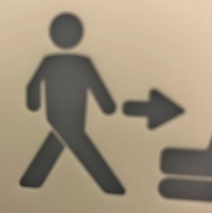 graphic of person walking cross-legged toward the toilet
